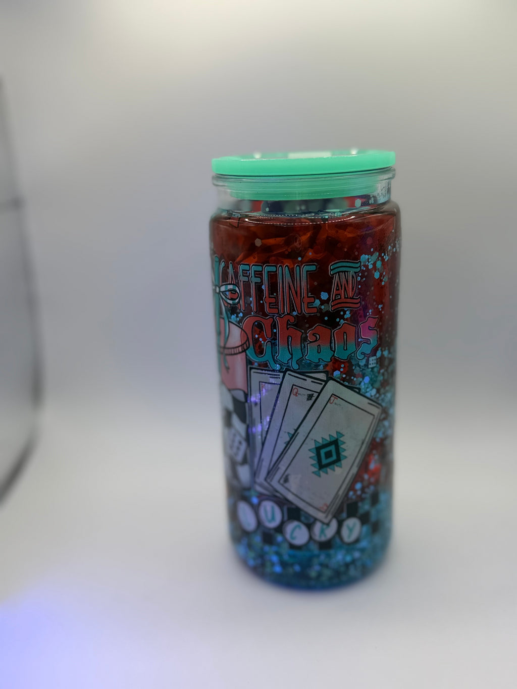 20 oz Caffeine and Chaos snow globe cup with Dice straw topper and checkered straw