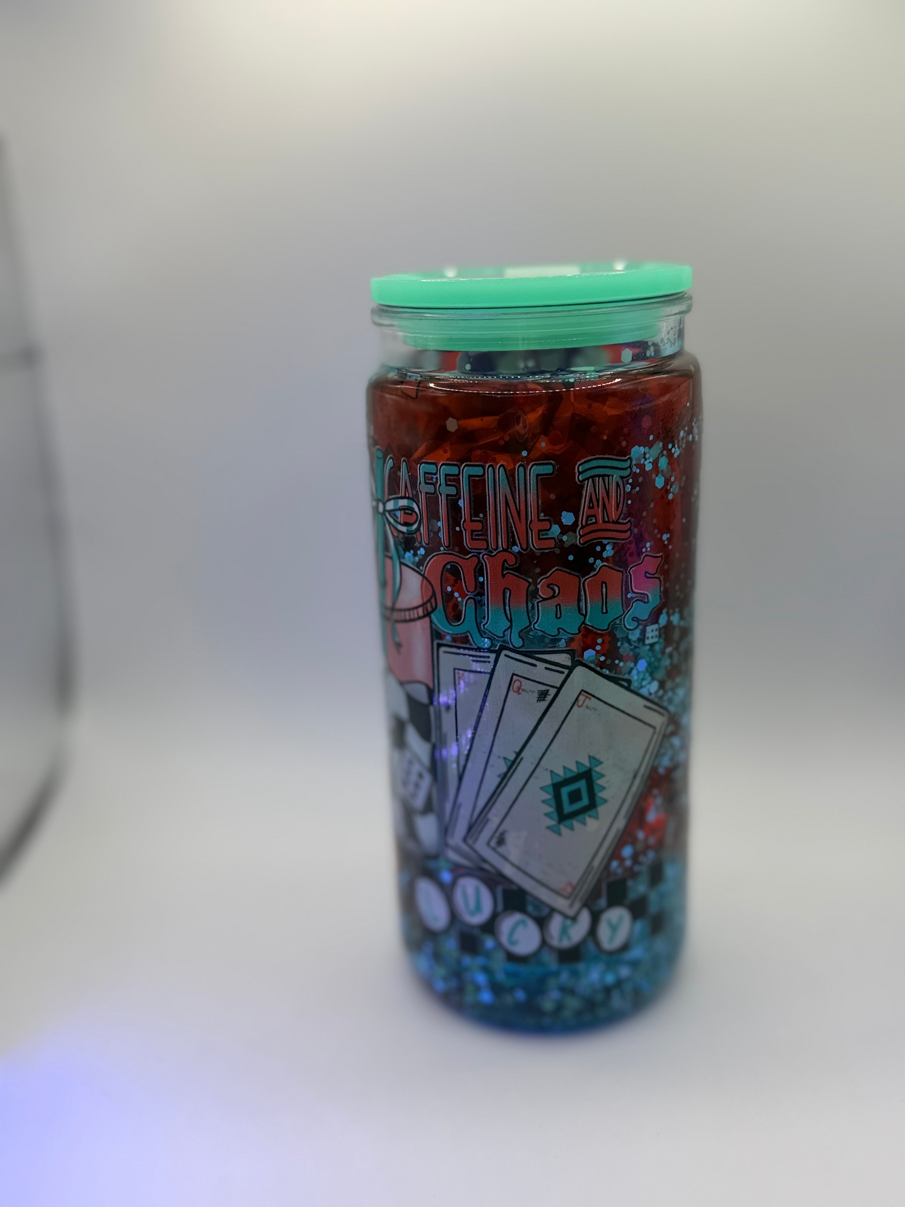 20 oz Caffeine and Chaos snow globe cup with Dice straw topper and checkered straw