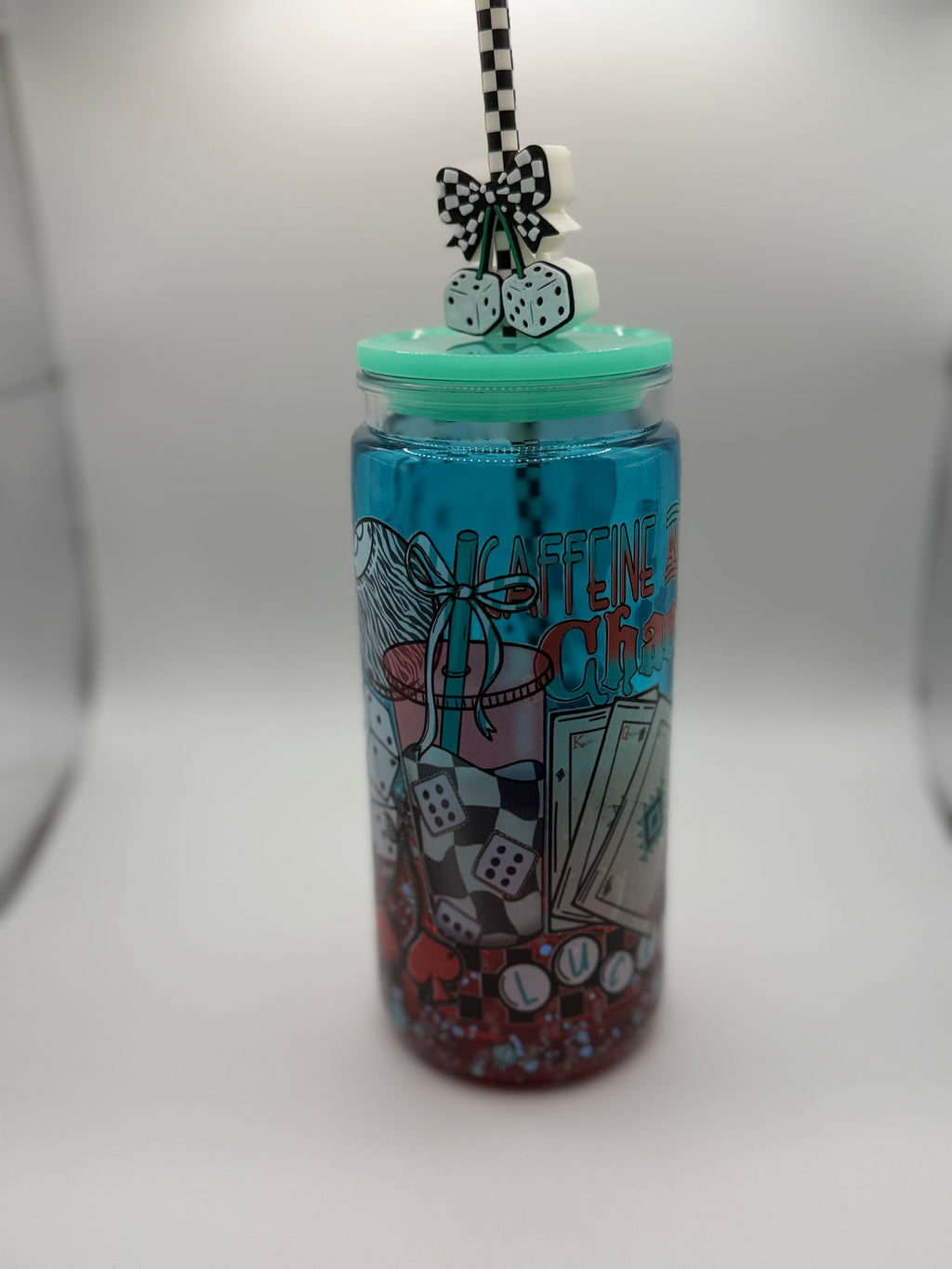 20 oz Caffeine and Chaos snow globe cup with Dice straw topper and checkered straw