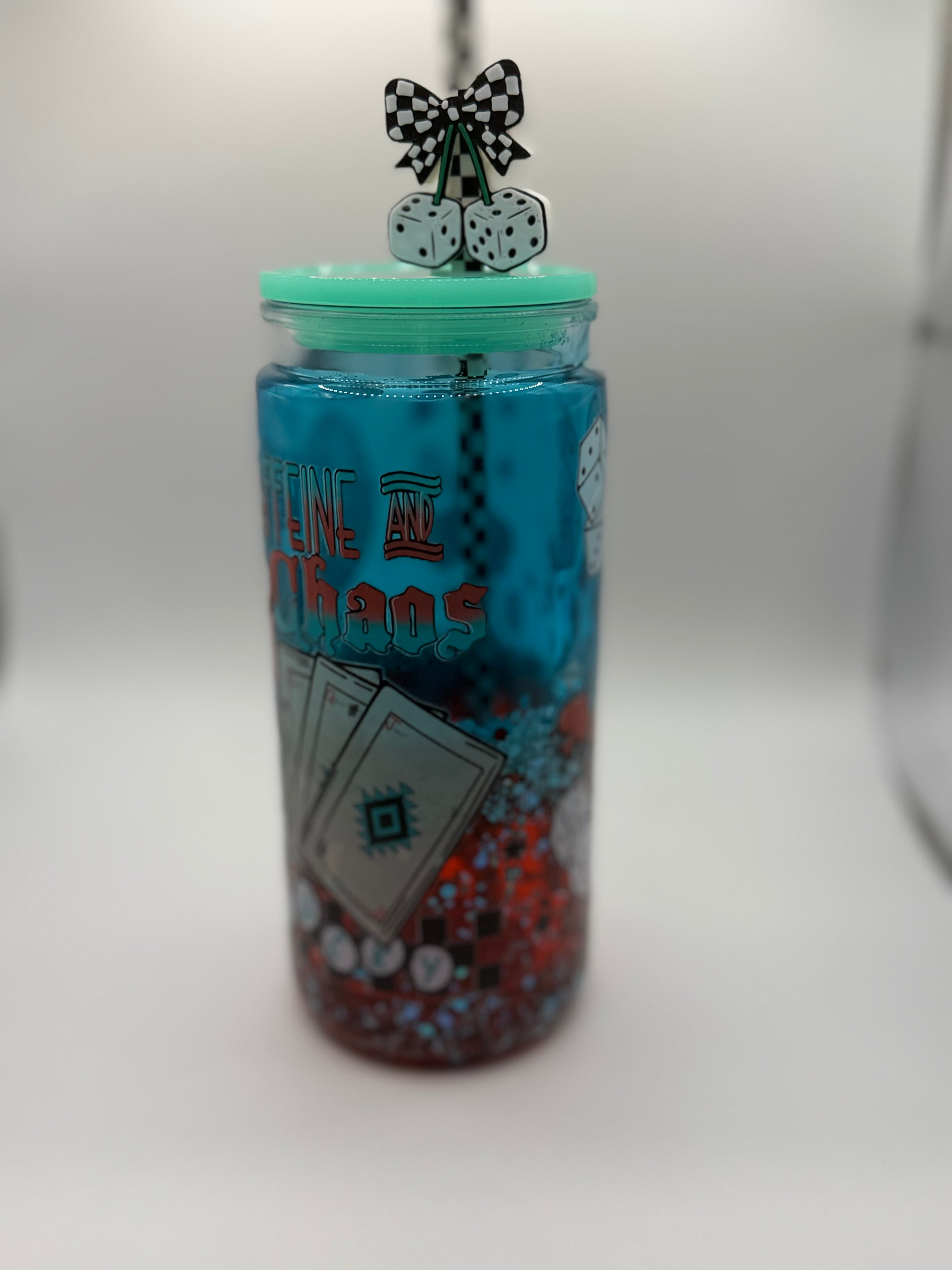 20 oz Caffeine and Chaos snow globe cup with Dice straw topper and checkered straw