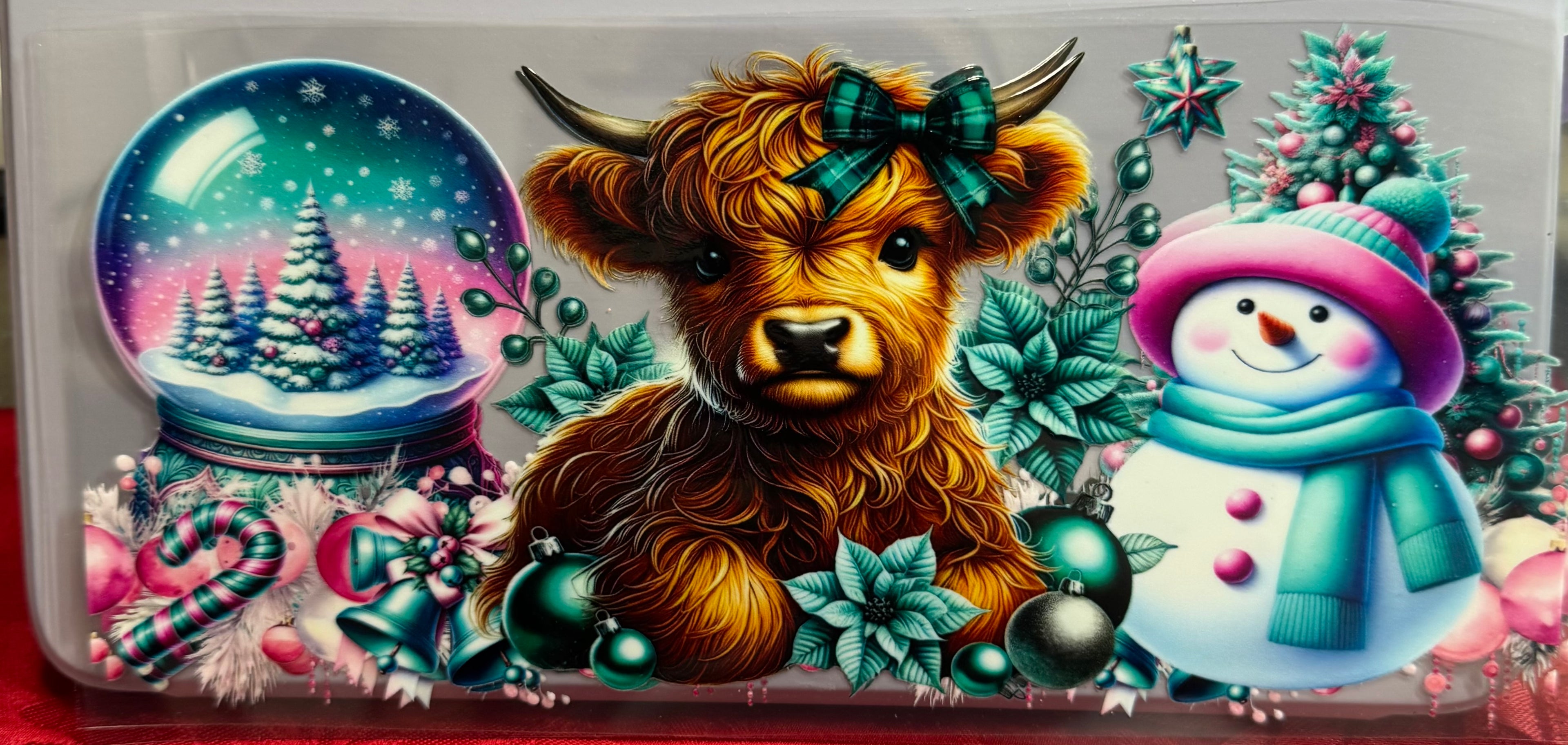 Cow with snow globe and snowman wrap
