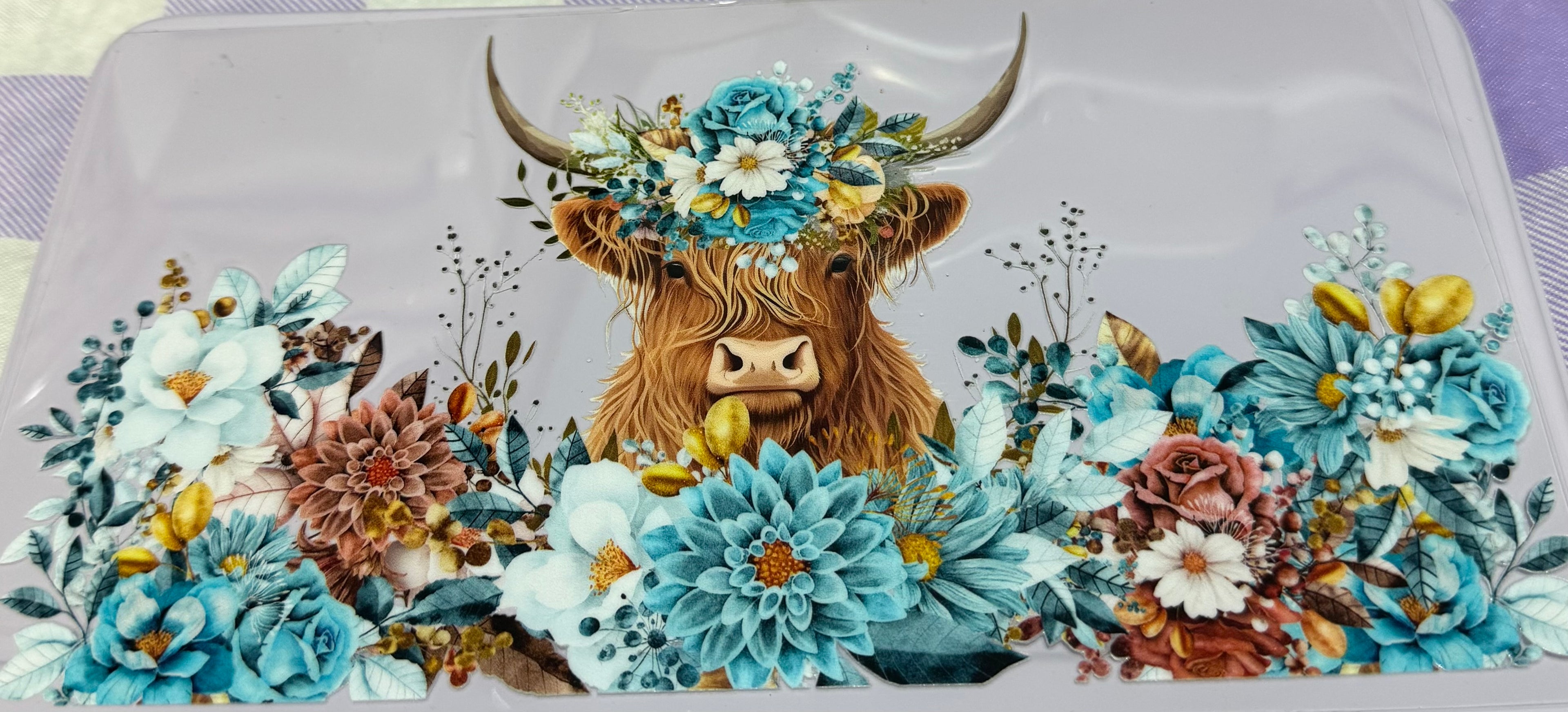 Cow with teal flowers wrap